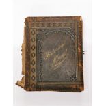 A Victorian leather photograph album with decorated pages 'Memorial of England's Glories', 23 x