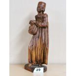 A lovely 17th C carved limewood figure of a lady with glass eyes. Notation to the base refers to