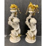 A pair of white finished vintage cherub 'chalk' plant stands, H. 70cm.