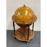 A vintage globe drinks trolley, H. 93cm.