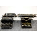 Two early typewriters.