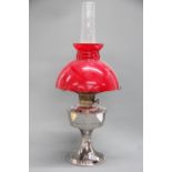 A chromium plated oil lamp, Aladdin 21 with shade, H. 61cm.