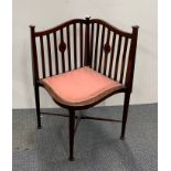 An unusual Edwardian mahogany inlaid corner chair.