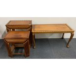 Two nests of oriental carved teak side tables and a matching coffee table.