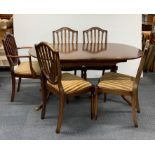 A regency style mahogany extending dining table, 89 x 150cm, together with five shield back chairs.