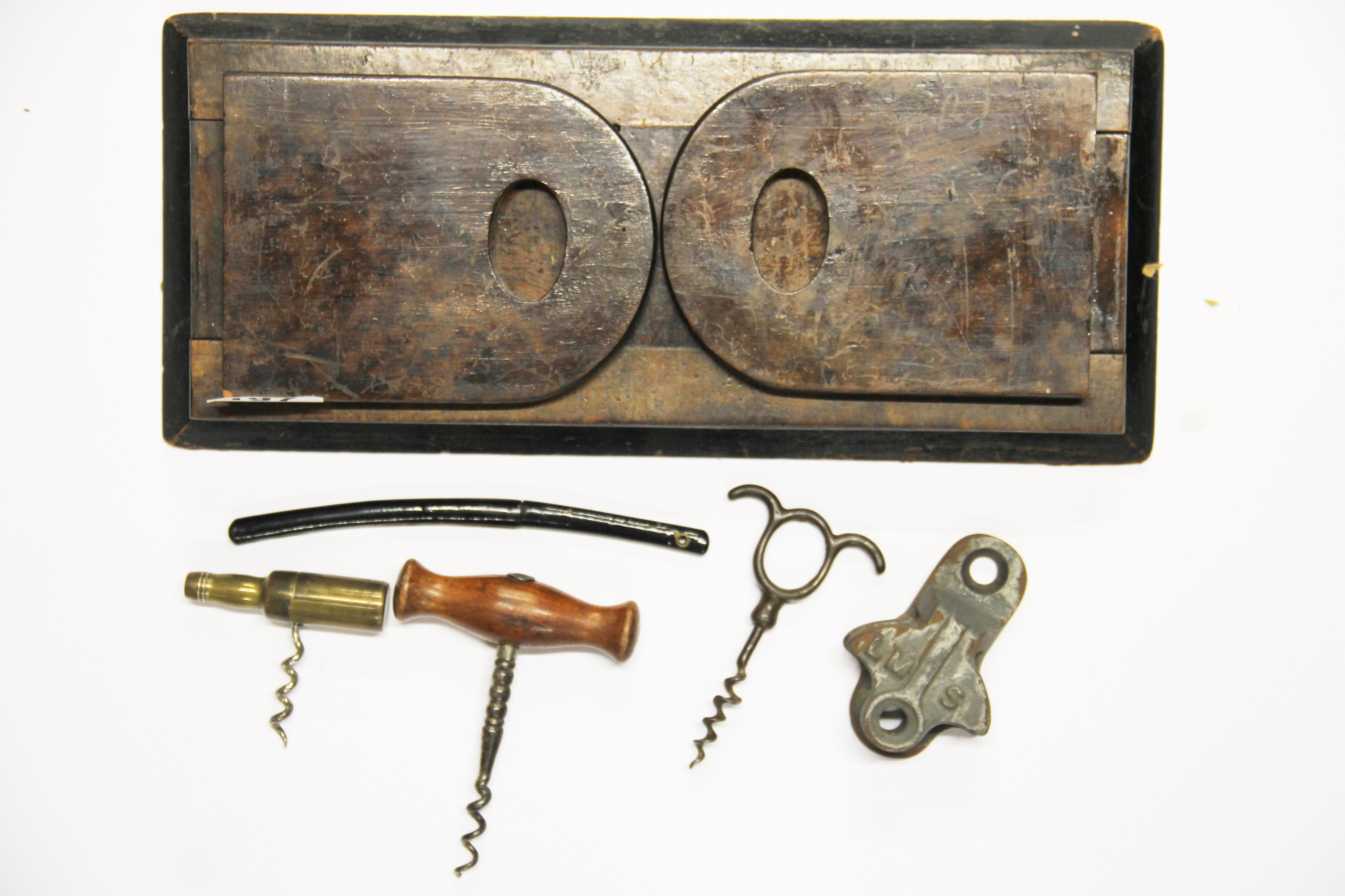 A Victorian folding bookrack, 3 corkscrews, a Japanese letter opener and a LMS railway item.