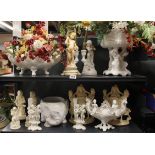 A group of porcelain and resin cherub figures etc, tallest H. 37cm.