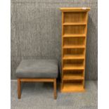 A useful polished light oak CD/book rack and footstool.