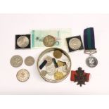 A quantity of mixed coins and medals.