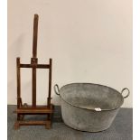 A zinc bath, W. 59cm, together with a small artists easel and an artists two drawer chest.