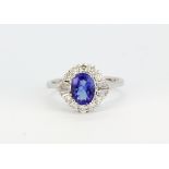 An 18ct white gold ring set with a centre cut tanzanite (1.19ct) surrounded by baguette and