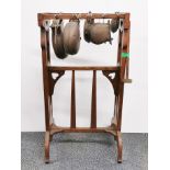 A 19th C Art Nouveau oak framed 'cowbell' musical instrument, H. 77cm.