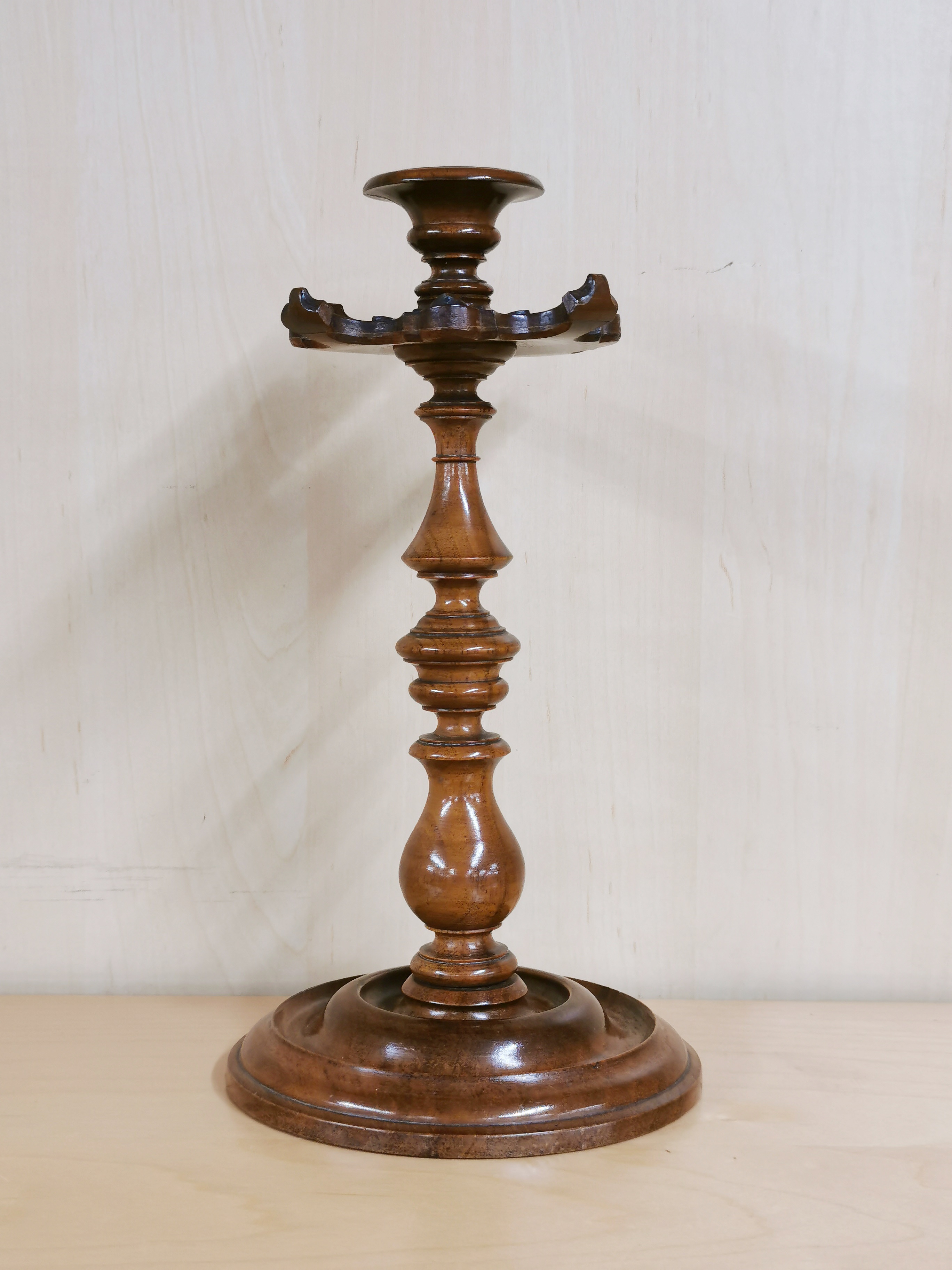 A lovely 19th C carved walnut candlestick, H. 27cm.