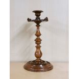 A lovely 19th C carved walnut candlestick, H. 27cm.