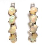 A pair of 925 silver hoop earrings set with cabochon cut opals, Dia. 2.7cm.