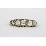 An antique 18ct yellow gold ring set with five graduated old brilliant cut diamonds, approx. 1.