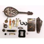 A Victorian sovereign case, miniature retractable chain, brooch and other small items.