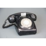 A vintage black telephone.