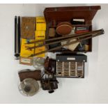 A quantity of old photographic equipment and cameras.