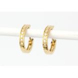 A pair of 18ct yellow gold diamond set hoop earrings, L. 1cm.