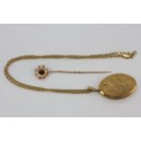 An antique rolled gold locket pendant, L. 3.5cm, on a yellow metal chain, approx. L. 42cm,