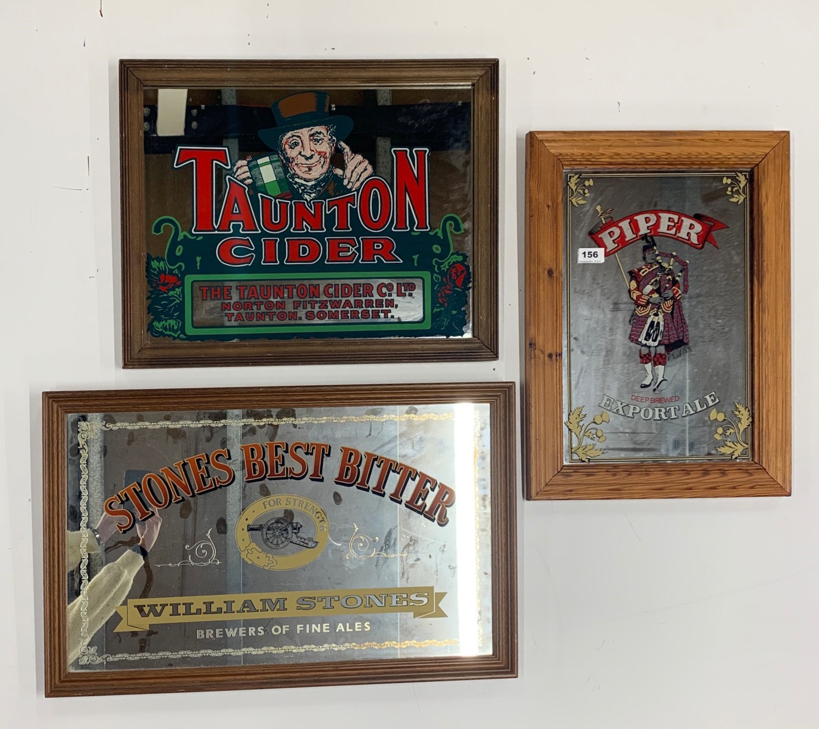 Three framed pub advertising mirrors, largest. 43 x 69cm.