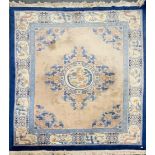 A large Chinese washed wool carpet, 330 x 247cm.