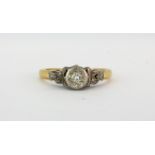 An antique 18ct gold and platinum diamond set solitaire ring, (L).