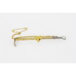 A 9ct yellow gold and silver fox riding crop brooch, L. 6.2cm.