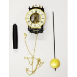 A German skeleton wall clock, 20cm.