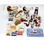 A quantity of dolls house children's items, including prams, high chairs, toys, etc.