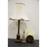 A large brass column table lamp and shade, overall H. 94cm, together with an onyx table lamp and a