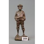 An early 20th Century bronze figure of a boy in a sailor suit, H. 21cm.