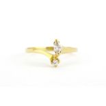 A yellow metal (tested 18ct gold ring) set with a marquise and a brilliant cut diamond, (N.5).