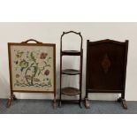 An Edwardian mahogany cake stand and two fire screens.