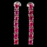 A pair of 925 silver drop earrings set with oval cut rubies, L. 3cm.