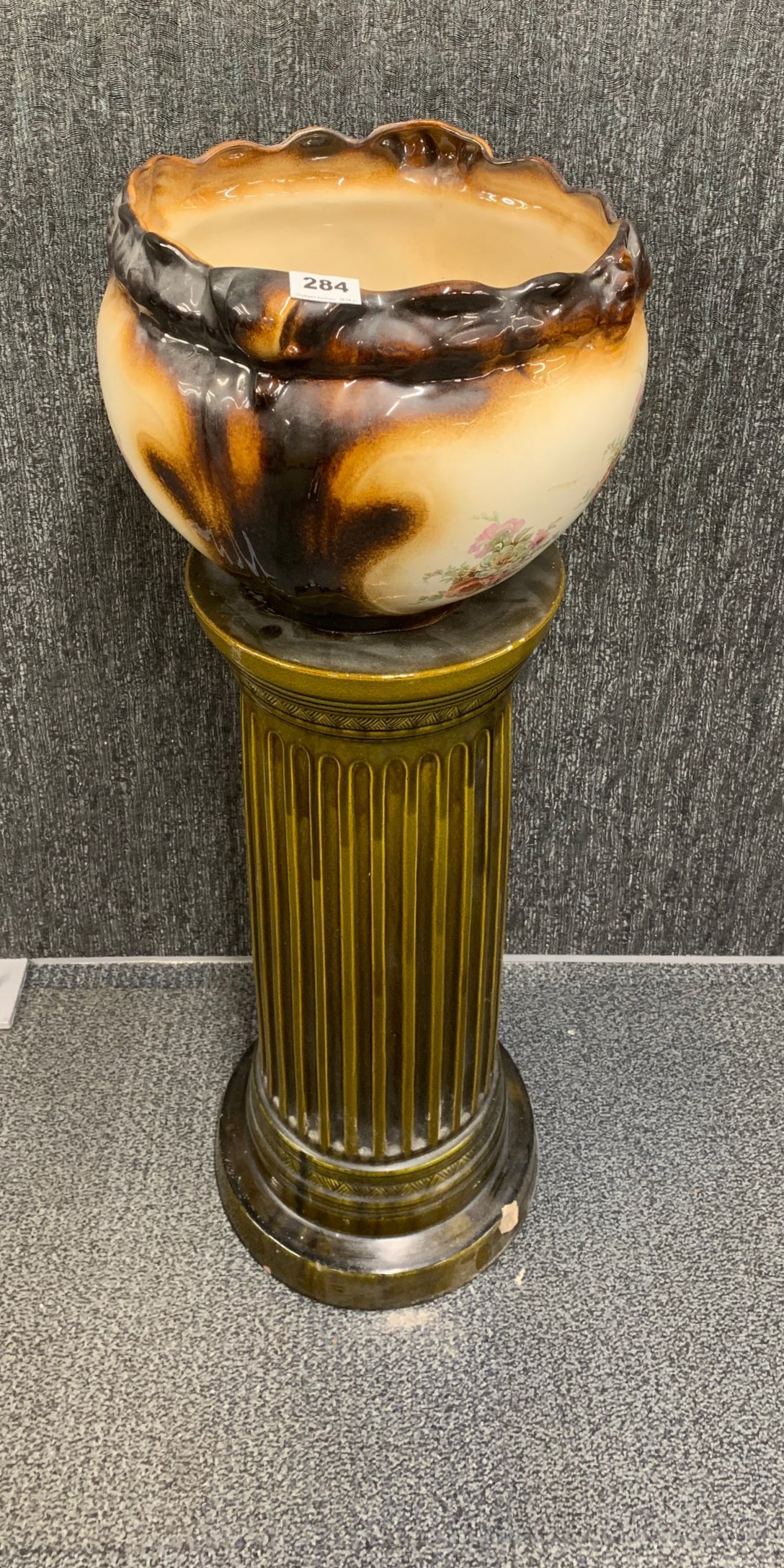 A 19th century ceramic plant holder with similar pedestal stand, overall H. 92cm.