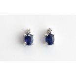 A pair of 9ct white gold sapphire and diamond set stud earrings, L. 0.5cm.