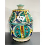 A Moroccan hand painted pottery jar and cover, H. 20cm.