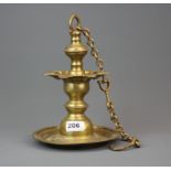 An early Nepalese bronze hanging oil lamp and chain, Dia. 18.5cm. H with chain. 63cm.
