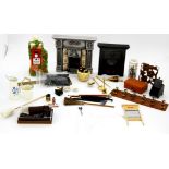 A quantity of dolls house cleaning items, two fireplaces and others.