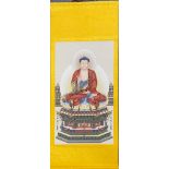 A large silk mounted scroll of a seated Buddha, 67 x 150cm.