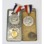 A quantity of royal commerative medals and tin.