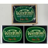 A framed and illuminated Wexford Irish cream ale advertising sign plus two unframed signs, frame