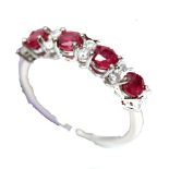 A matching 925 silver ring set with oval cut rubies and white stones, (N.5).