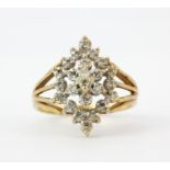 A 9ct yellow gold diamond set cluster ring, (M).