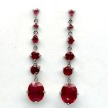 A pair of 925 silver drop earrings set with oval cut rubies, L. 5.5cm.