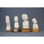 A group of 1930's African carved ivory busts of young women, tallest H. 22cm.