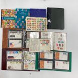 A quantity of mixed first day cover and stamp albums.