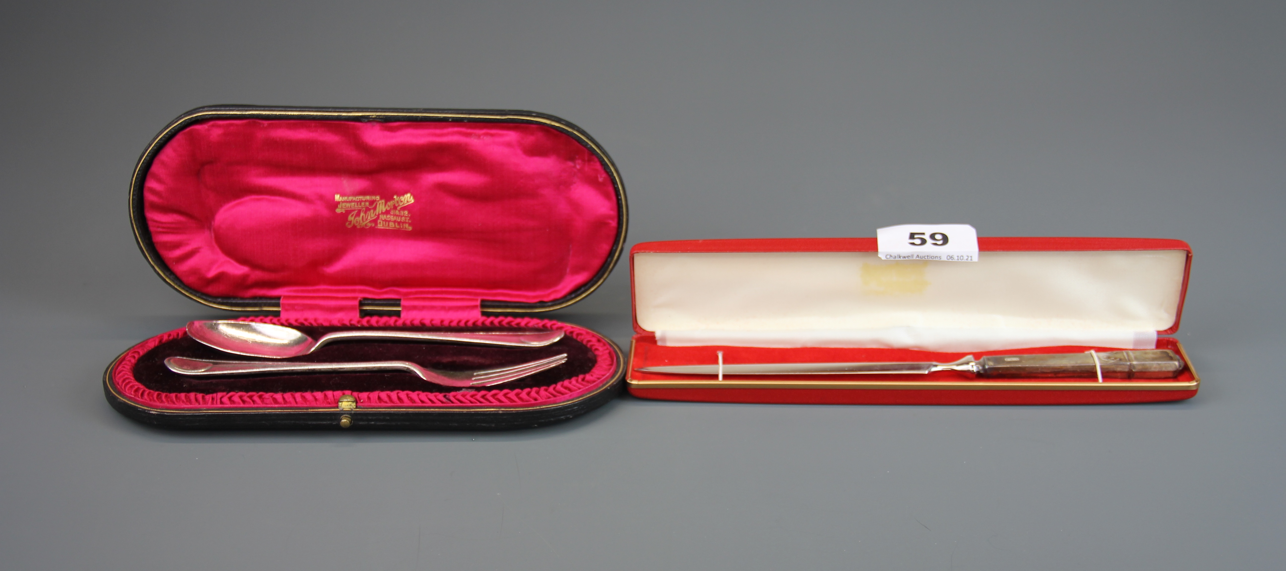 A cased hallmarked silver christening set together with a hallmarked silver handled paper knife.